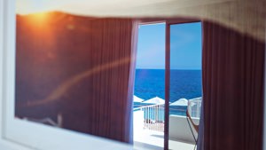 The bedroom’s balcony glass door offers a wonderful and breathtaking view of the ocean.