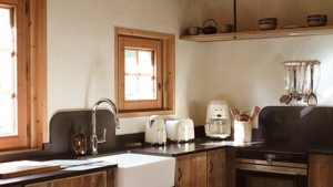 A clicked photo of a properly arranged kitchen showcasing neat and organized space.