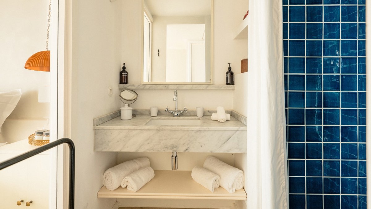 A premium-finished bathroom is shown, with every small essential neatly and properly placed throughout.