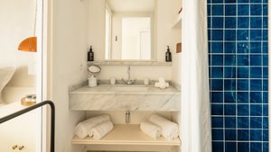 A premium-finished bathroom is shown, with every small essential neatly and properly placed throughout.