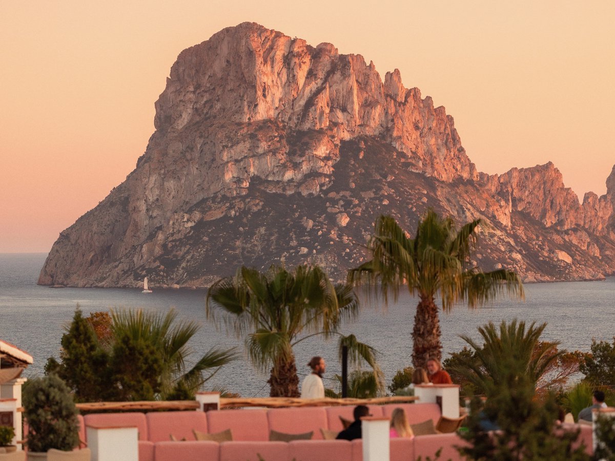 Panoramic view of the sunset over Es Vedrà from the terrace of La Mirada restaurant at Beaumier hotel Petunia in Ibiza