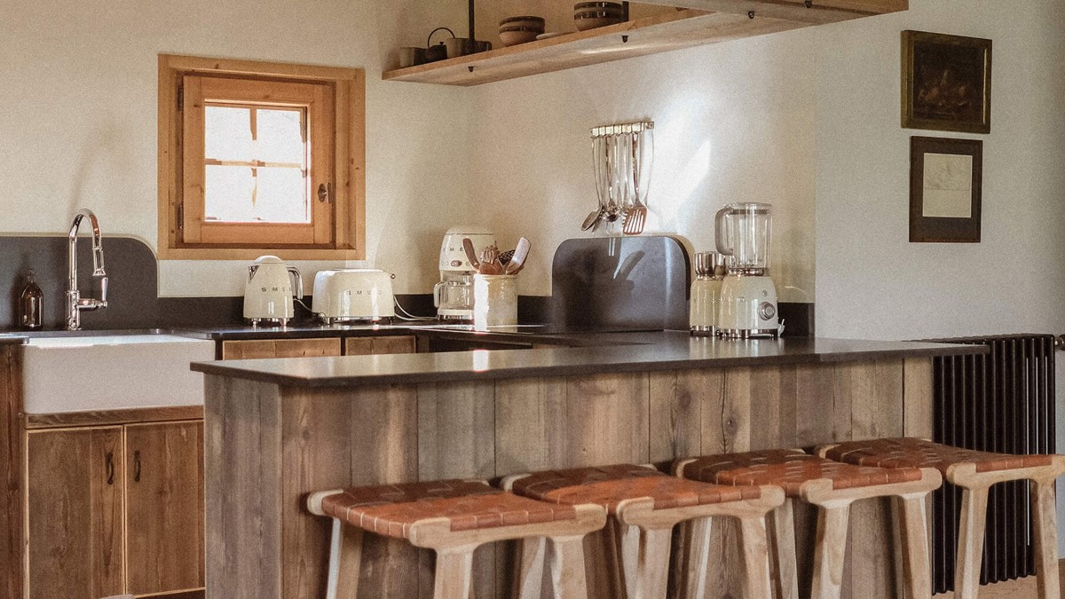 A photo of the kitchen shows all essential items neatly organized and properly arranged.