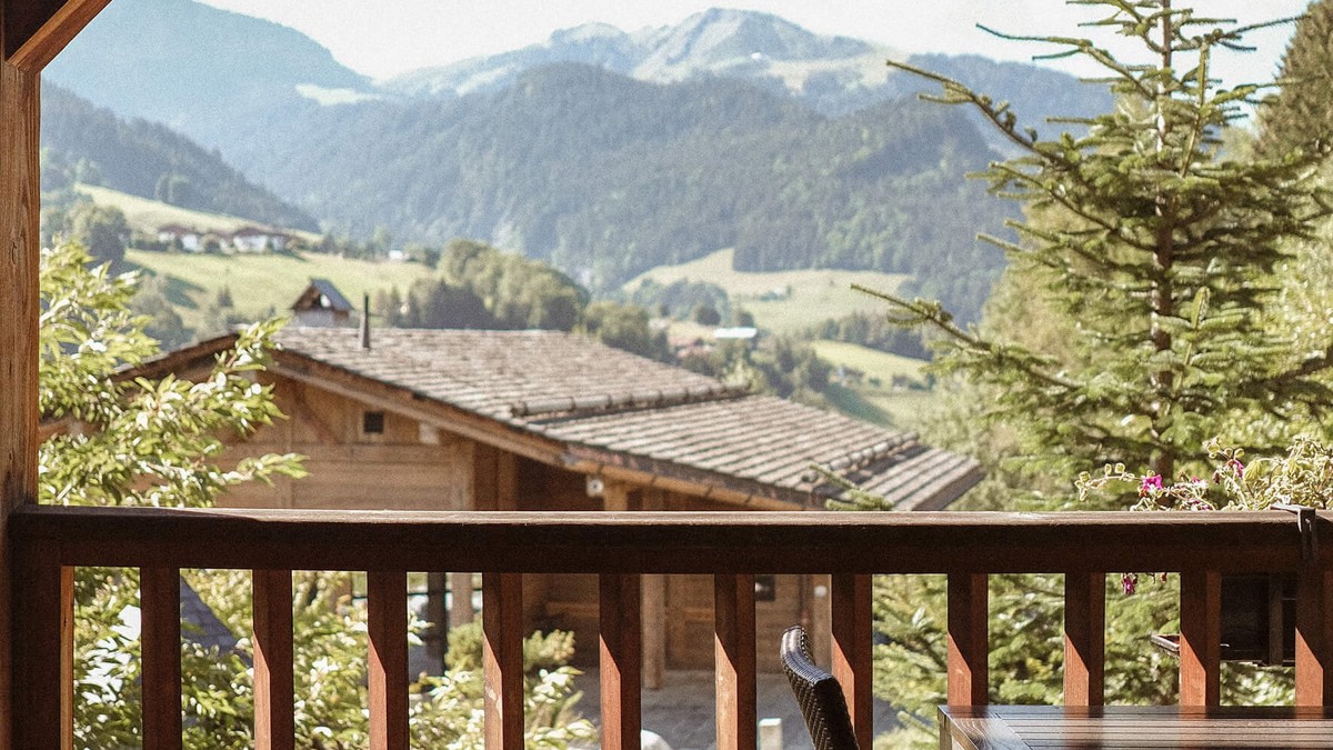 A wonderful view of lush green mountains can be seen from the house corridor.