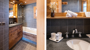 Two clicked photos display the bathroom: right shows the bathing area, left shows washbasin countertop.