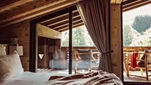 A clicked photo shows a cozy chair on the balcony offering a wonderful tree view.
