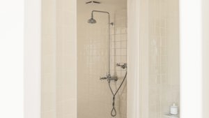 A photo captures a fitted shower installed neatly in the bathroom.